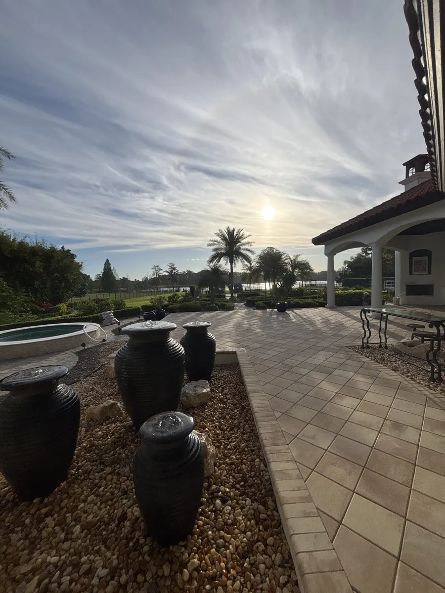 Sealed patio with urn fountains, late afternoon light