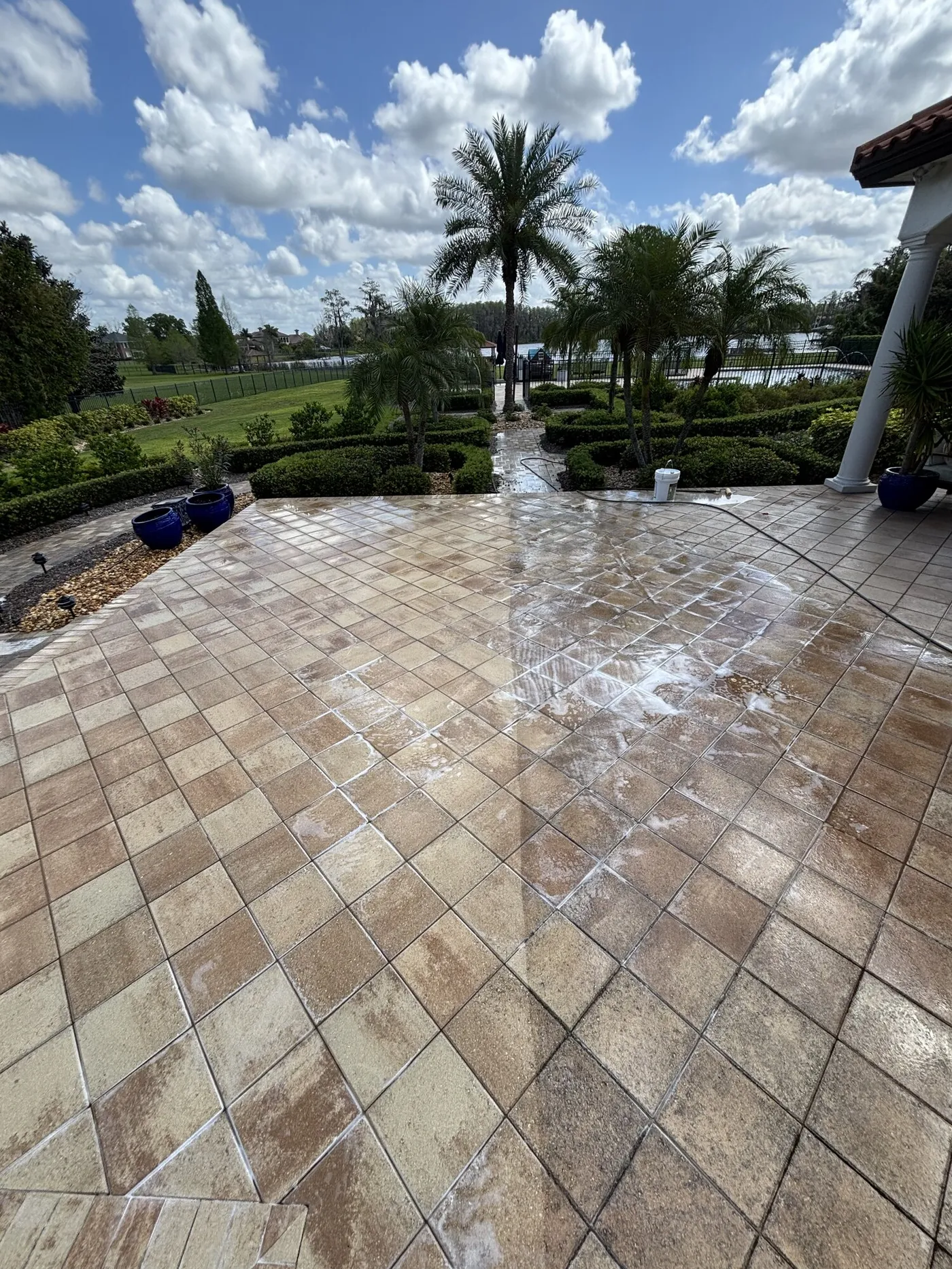 The same travertine patio after sealing, colour and depth restored