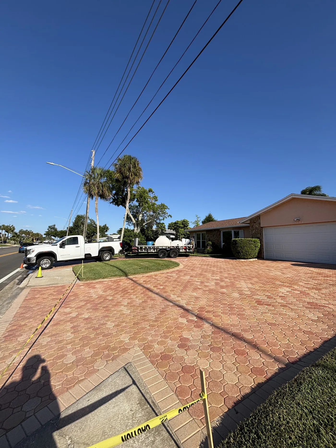 The same brick paver driveway after washing, red colour restored